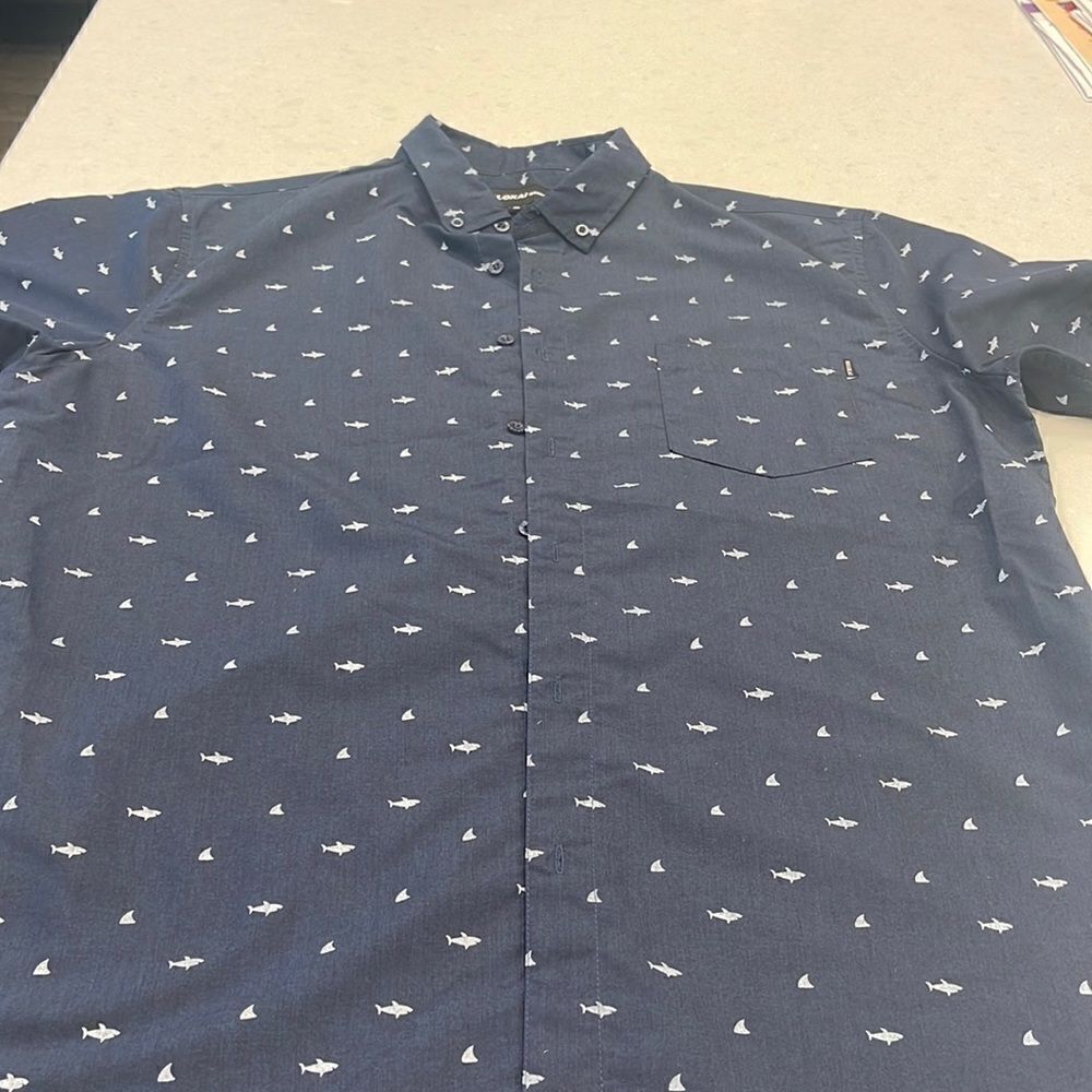 Molokai men’s XL short sleeve shirt shark/ fins. Super cool. Great vacation!
